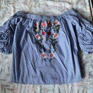 Off the shoulder light blue shirt